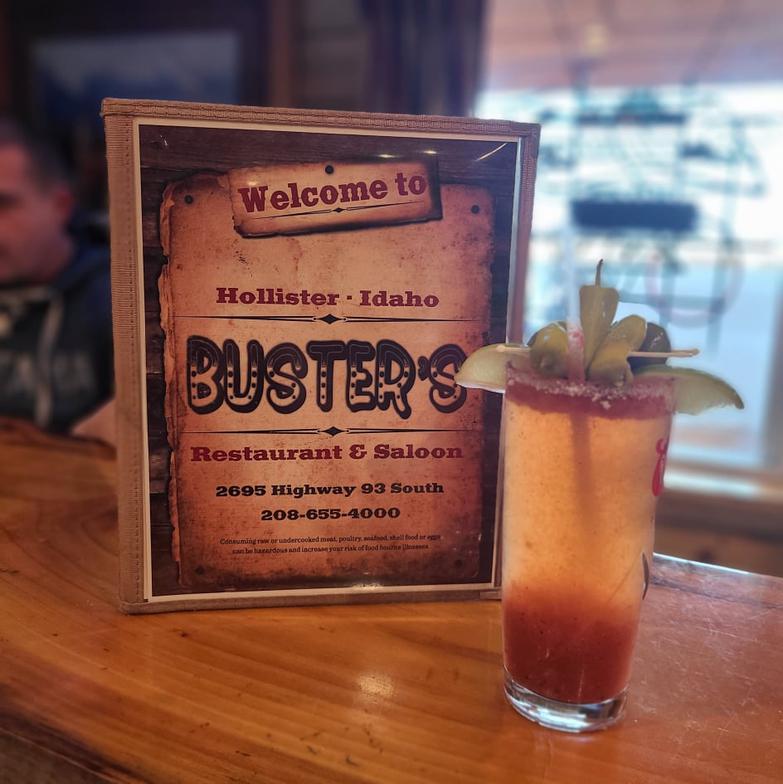 A Buster's menu next to a drink