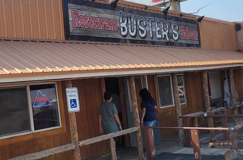 Outside Buster's Restaurant with people heading inside