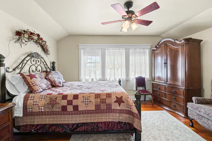 A picture of a bedroom with Beige Walls