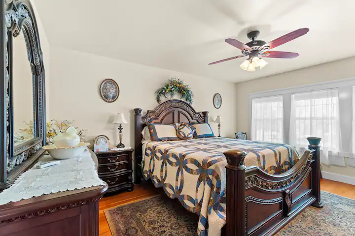 A picture of a bedroom with Yellow walls