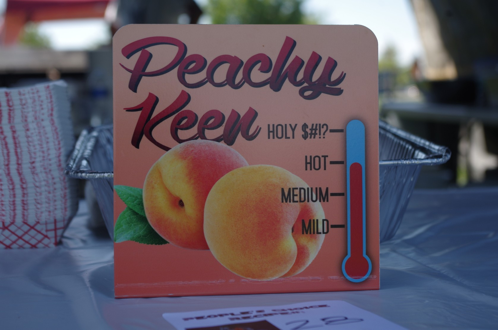 A sign that reads Peachy Keen